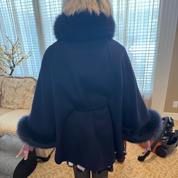 Navy blue reversible jacket with snaps and belted. Fox fur